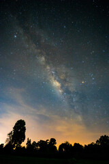 Fototapeta na wymiar Night sky atmosphere, Milky Way, and stars on dark background with grain and Noise.