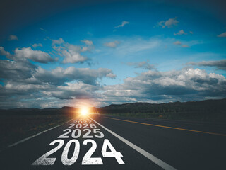 New Year direction concept and sustainable development concept On the road labeled 2024 to 2030 at...