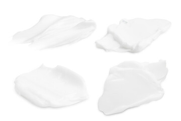 A set of different strokes of white cream on a blank background. PNG