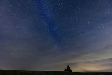Middle european nightscape near an ancient watchtower. Milkyway, nightsky and stars