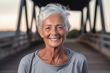 Fototapeta na wymiar Editorial portrait photography of a glad old woman wearing a sporty polo shirt against a rustic bridge background. With generative AI technology