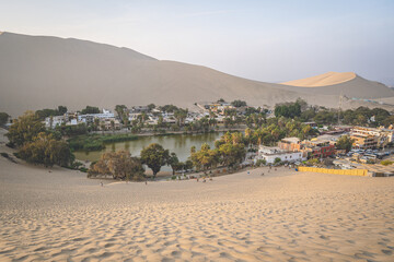Sunset in the Huacachina oasis in Ica, Peru - 623485797