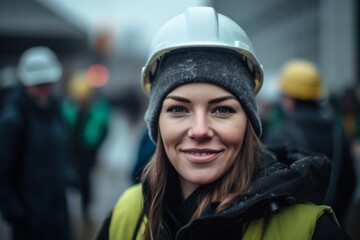 Naklejka premium Close-up portrait photography of a glad girl in her 30s wearing a warm beanie or knit hat against a busy construction site background. With generative AI technology