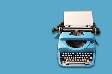 Vintage typewriter on blue background. Top view with copy space