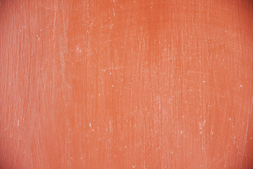Texture of old, scratched red concrete wall for background. High resolution