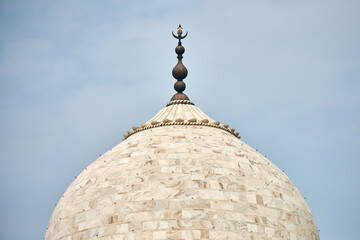 Close up Taj Mahal dome white marble mausoleum landmark in Agra, Uttar Pradesh, India, beautiful dome of ancient tomb building of Mughal architecture, popular touristic place