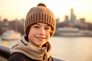 Casual fashion portrait photography of a happy kid male wearing a warm beanie or knit hat against a scenic riverboat background. With generative AI technology