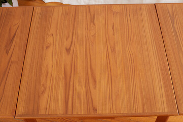 Teak wood grain texture. The pattern on a vintage wooden table top. 