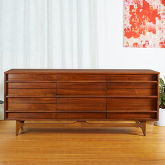 Classic mid-century modern dresser. Vintage wooden bedroom furniture. Interior view with white...