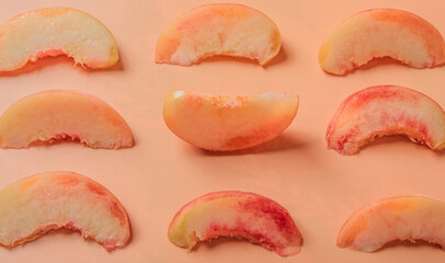 Peach slices on a beige background