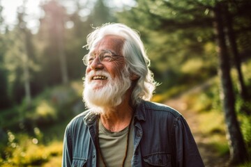 Photography in the style of pensive portraiture of a happy old man wearing a casual t-shirt against a serene nature trail background. With generative AI technology