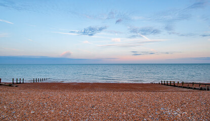 Clouds at sunset at Pevensey Bay beach - obrazy, fototapety, plakaty