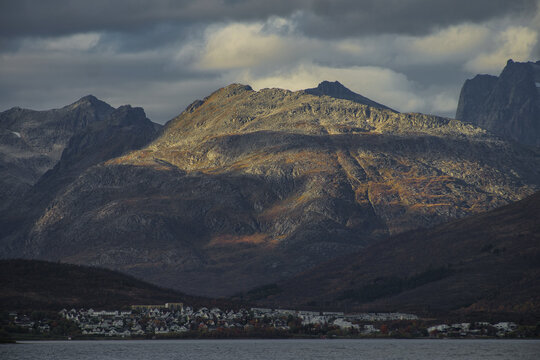 Dramatic light and clouds over mountain peaks around Tromso northern norway