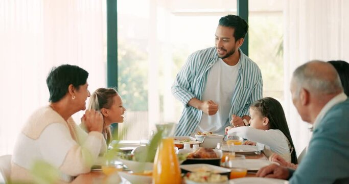 Thanksgiving, food and a father serving his family while eating food for bonding in celebration. Love, lunch or brunch with a man carrying a dish to the dining room table during a holiday event
