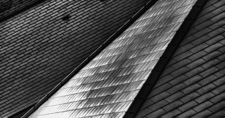 Abstracty view of an idustrial roof with slate tiles