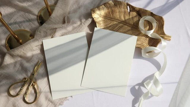 Video two 5x7 cards mockup with golden plate on beige background 