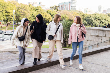 Fototapeta premium Four multiracial, college-educated, female friends