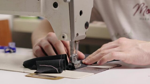Working on industrial garment machine, flat machine