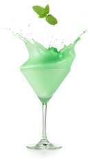 Mint leaf falling into a splattering grasshopper cocktail served in martini cup isolated on white background. Real shot.