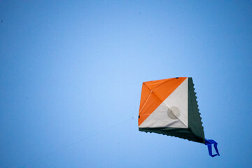 colorful kite flying on makar sankranti independence republic day with india's tricolor flag...