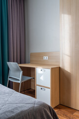 chair near the desk in the hotel room