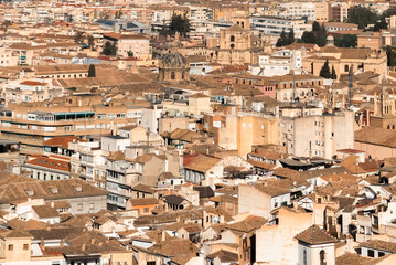 Panoramic landscape of Granada, Spain with blue sky.