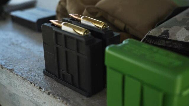 Clips with loaded cartridges for shooting