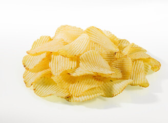 A bunch of potato chips with dill on a white background