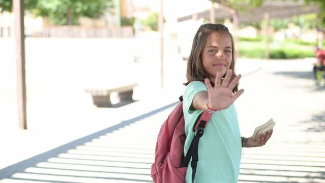 Handheld Clip Of A Beautiful Girl Saying Goodbye. Back To School.