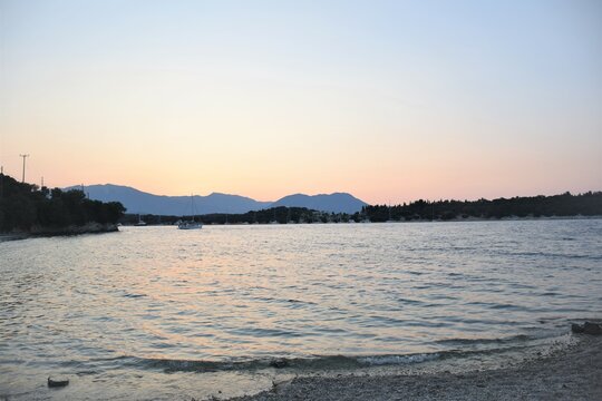 Image of sunset sky at the beach on the Meganisi island in Greece.