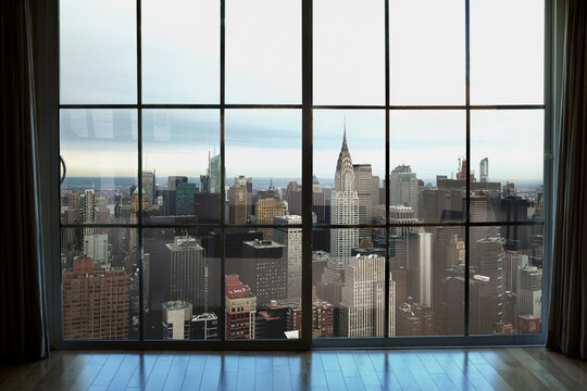 Fototapeta high rise window view of Midtown Manhattan interior real estate apartment in New York City NYC