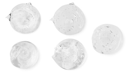 A set of smears and drops or drops of a transparent gel, serum. On an empty transparent background.