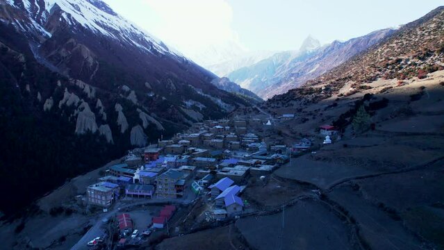 Aerial panning view colorful traditional Khangshar village houses.Manang district. Tilicho base camp trail. Himalayas mountains. Tourism and Trekking in Himalayas concept.