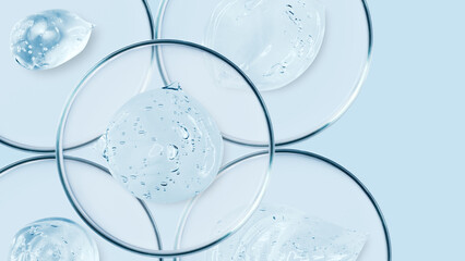 Fototapeta na wymiar Petri dishes and drops and ointments of transparent gel or serum on a blue background. Banner with empty space for advertising.
