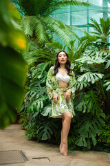 portrait beautiful young asian woman relax and smile in tropical garden hotel for vacation travel