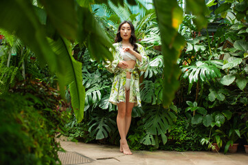 portrait beautiful young asian woman relax and smile in tropical garden hotel for vacation travel