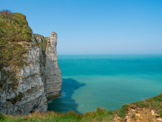 White cliffs of Etretat, Normandy, France,  with stunning view of the emerald sea ( the channel)...