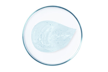 Petri dish with a drop and a smear of a transparent gel or serum on an empty background.