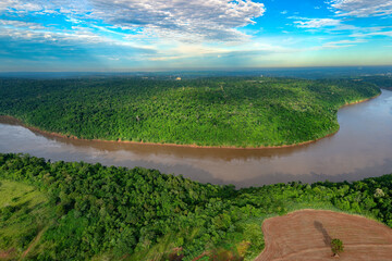 Aerial view of the Iguazu River on the triple border of Brazil, Argentina and Paraguay. - obrazy, fototapety, plakaty