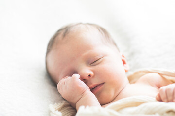 Cute baby sleeping 5 days old on light blanket. Banner design with space for text