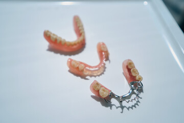 Top view of modern dentures lie on the table