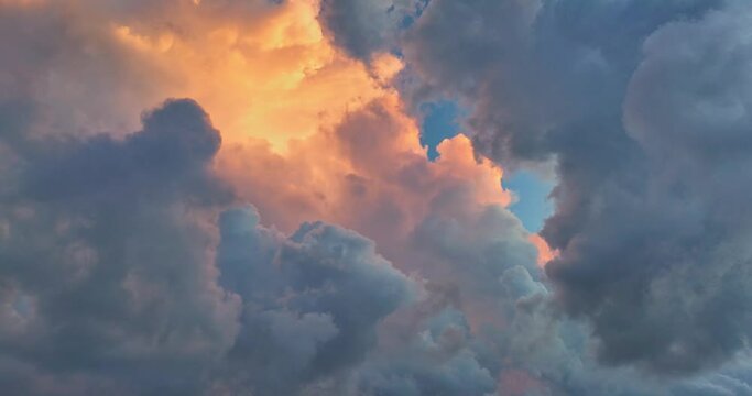 aerial view The purple clouds obscured the bright orange clouds that drifted slowly..Clouds Forming in stunning sunrise..The sky was dark, and in the distance, the clouds began to spin together,