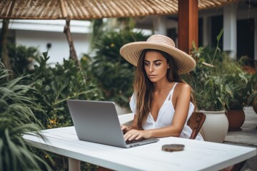 Woman working at the laptop in the backyard with a lot of greenery. Concept of remote work. AI Generated.