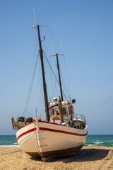 Fototapeta na wymiar Fishing boat at the shore