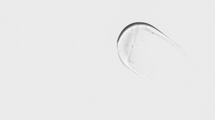 Composition of smears and drops or drops of transparent gel, serum. On a light background.