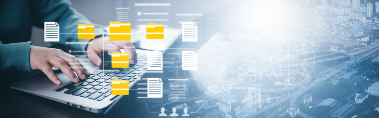 Document Management System DMS, set up by IT consultant working on a digital tablet and laptop...