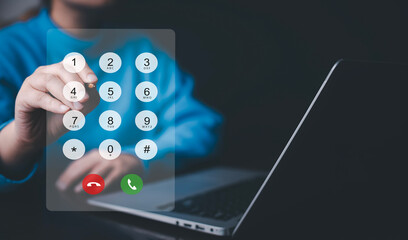 Dialing on virtual telephone keypad with transparent telephone buttons, businessman touch button of...