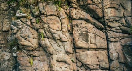 Stones on mountain surface. Granite background for design. Nature and landscape.