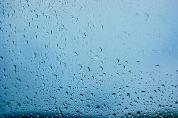 Raindrop on the glass. Waterdrops during raining in cold autumn day