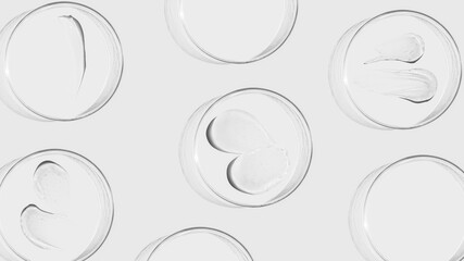 Petri dishes on a light background, transparent gel smears. Empty advertising space